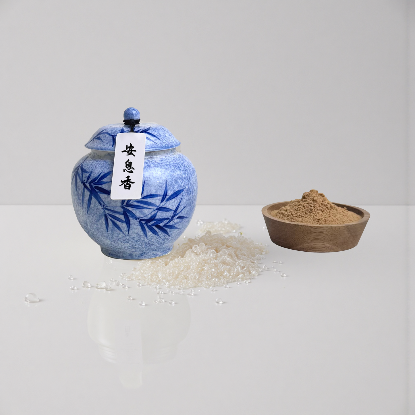 Anxi Blended incense powder next to a wooden bowl that is used to present the loose incense powder for display