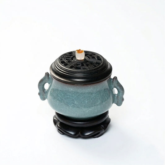 Luxury electric incense burner made of Ge kiln ice-crackle ceramic with side handles, black lid, and matching base