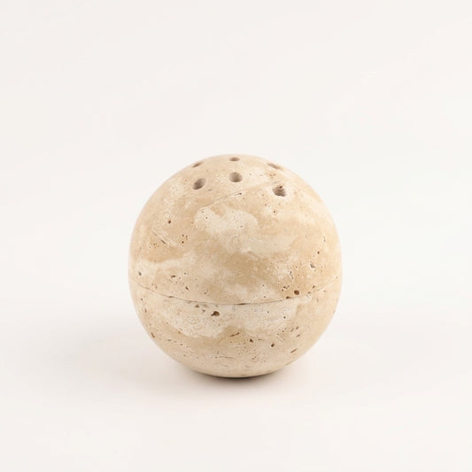 Natural travertine stone incense burner shaped like a smooth round sphere with small ventilation holes on the top and a horizontal seam around the middle, shown against a white background.