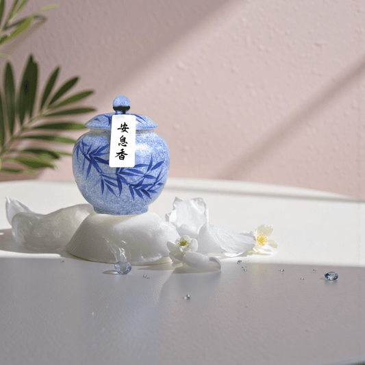 Anxi handcrafted natural incense powder in a blue ceramic jar, formulated to support restful sleep and calming rituals.