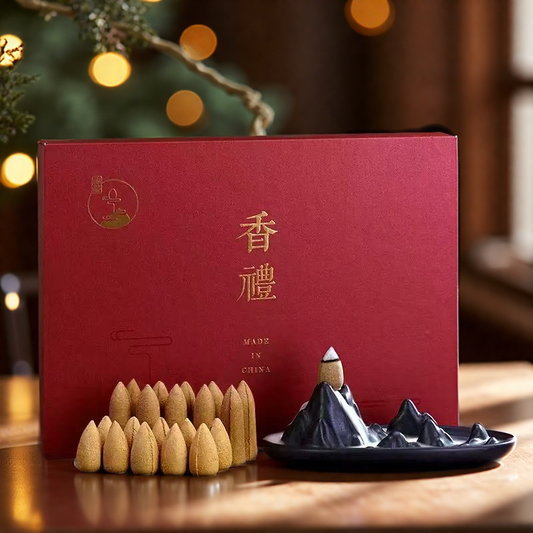 Elegant red gift box set featuring a ceramic mountain-shaped backflow incense burner and 20 natural agarwood cones, designed for relaxation and home decor