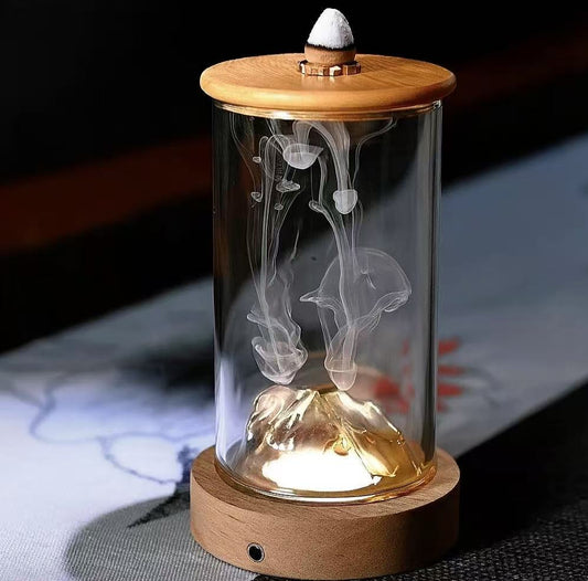 Glass backflow incense burner with wooden base and lid, featuring dolphin-shaped smoke flow inside the chamber.