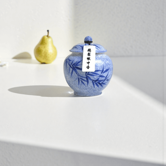 Midnight Pear handcrafted natural incense powder in a blue ceramic jar, featuring a calming pear and sandalwood aroma for meditation and aromatherapy.