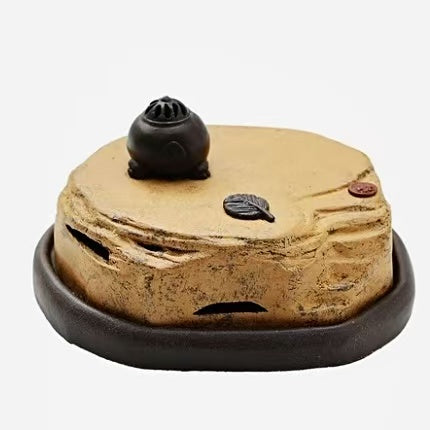 Vintage-style purple clay incense burner with landscape design and black base, lid featuring carved smoke holes