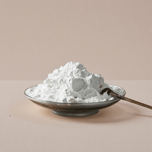 Refined natural incense ash displayed in a shallow dish with a small metal scoop, used for incense seals, burners, and cone making.