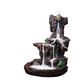 Mountain waterfall-style backflow incense burner with layered dark rock terraces, a cone holder at the top, and white cascading smoke flowing down into the basin below.
