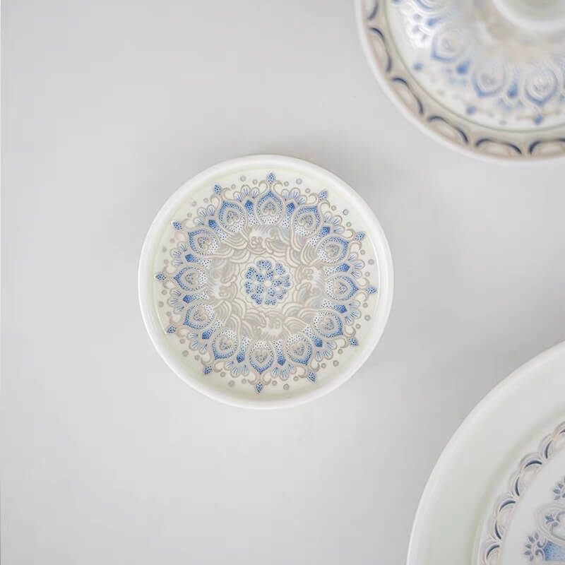 Top view of a blue and white ceramic lotus incense holder showing the detailed circular floral pattern on the tray
