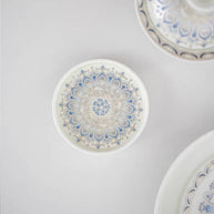 Top view of a blue and white ceramic lotus incense holder showing the detailed circular floral pattern on the tray