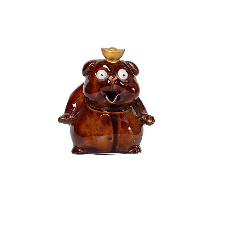 A front-facing studio shot of a glossy brown ceramic cute animal backflow incense burner, featuring wide white eyes and a small golden piece on its head, isolated against a plain white background.