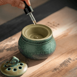 Ceramic electric incense burner with essential oil dropper, designed for flameless aroma heating, home fragrance, resin incense, incense chips, and daily relaxation use.