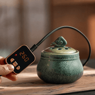 Ceramic electric incense burner with handheld temperature controller for flameless aroma heating, adjustable heat control, and everyday home fragrance use.