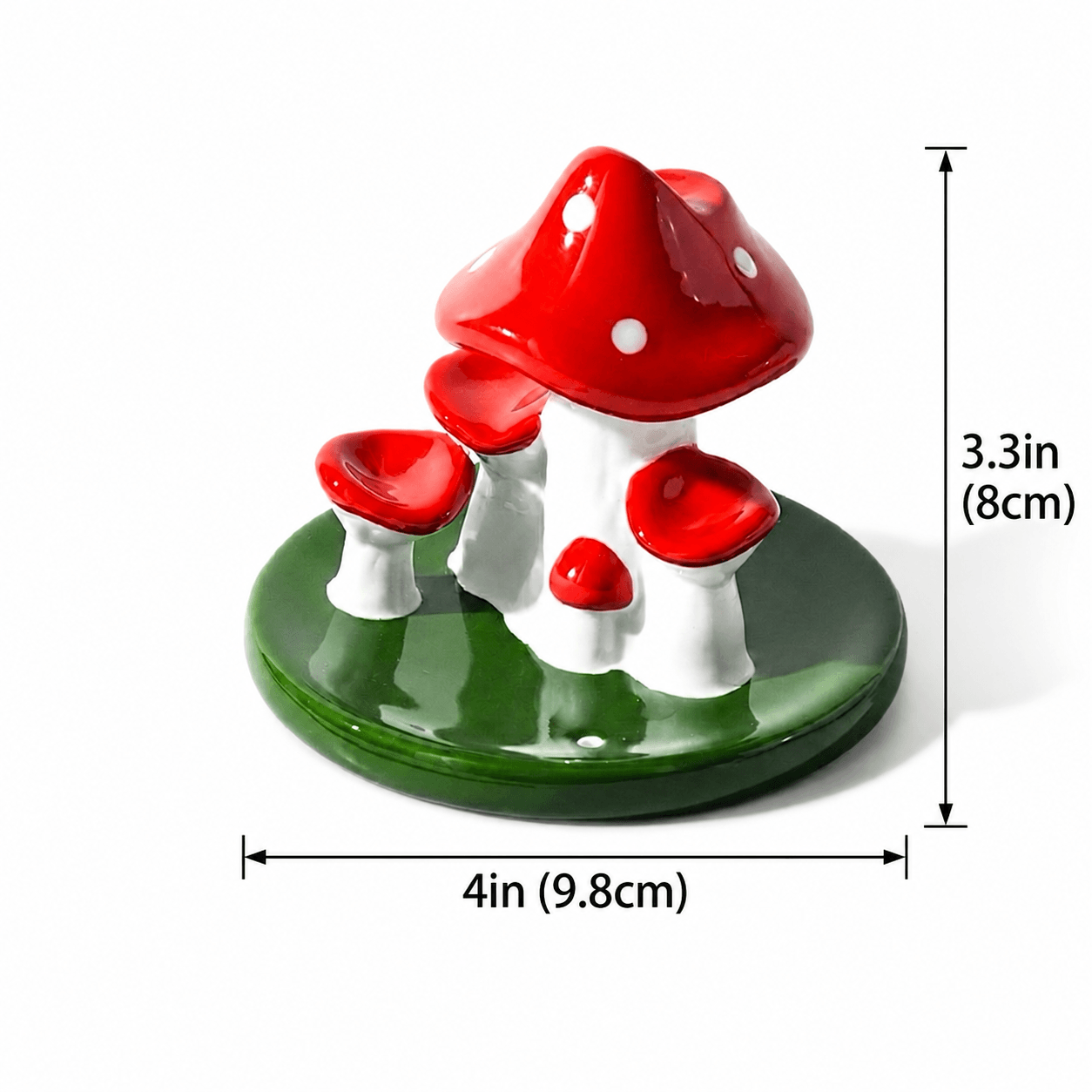 Ceramic mushroom backflow incense burner with glossy red caps, white stems, and a green base, shown with size markings of 3.3 in / 8 cm height and 4 in / 9.8 cm width.