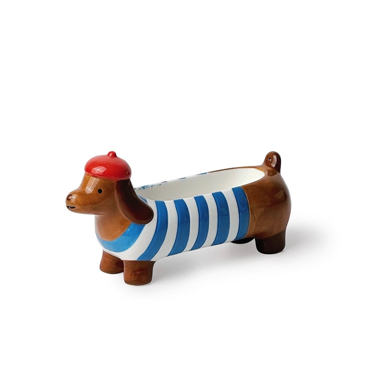 Brown ceramic dachshund incense holder with blue-white stripes and a red beret, three-quarter view on a white background.