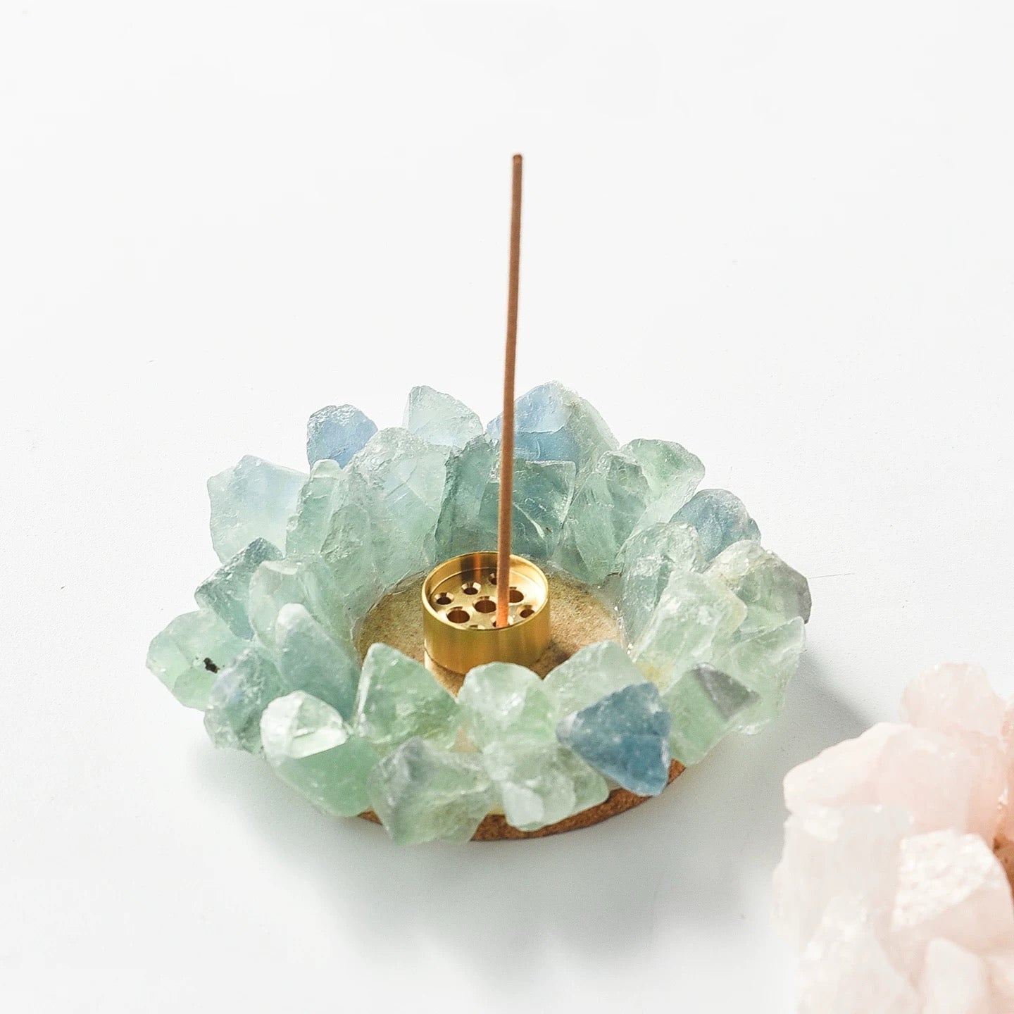 Raw green fluorite crystal incense holder ring with removable brass insert displayed separately on white background