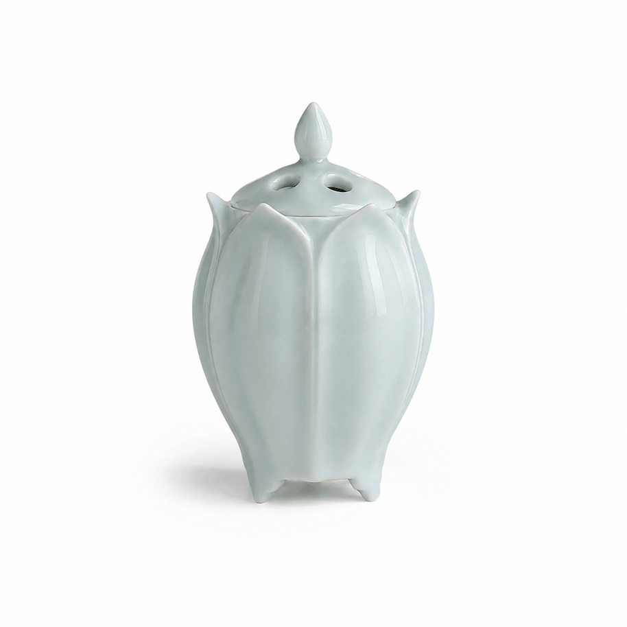 Green lotus shaped electric ceramic incense burner with a glossy finish on a white background