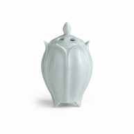 Green lotus shaped electric ceramic incense burner with a glossy finish on a white background