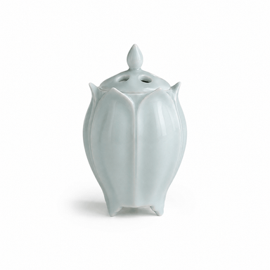 Green lotus shaped electric ceramic incense burner with a glossy finish on a white background