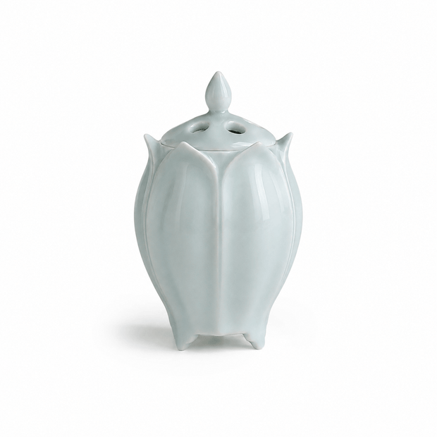 Green lotus shaped electric ceramic incense burner with a glossy finish on a white background