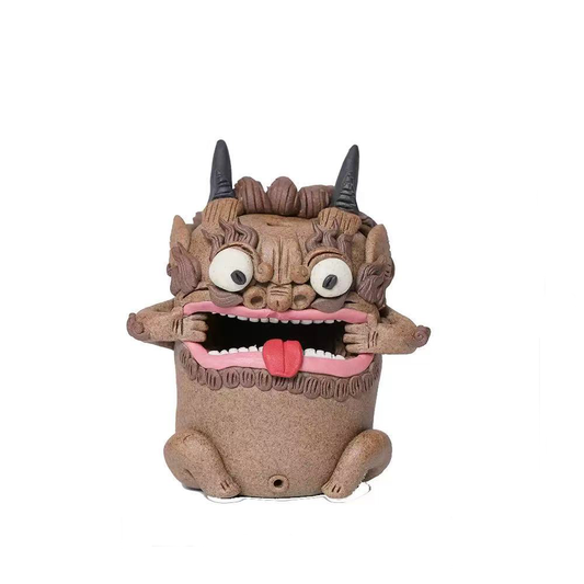 Handcrafted purple clay guardian backflow incense burner with black horns, wide round eyes, textured hair, open mouth, and red tongue, shown from the front on a clean white background.