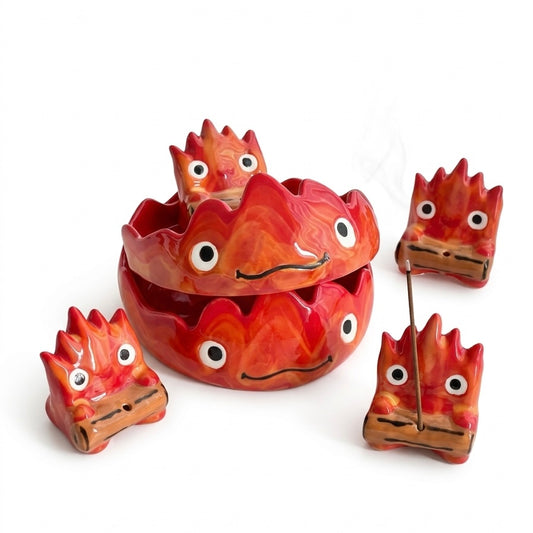 Handmade Calcifer ceramic tray and incense holder set with glossy red and orange flame spirit designs, featuring a round trinket dish and matching small incense holders on a clean white background.