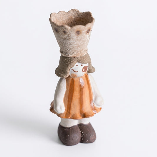 Handmade ceramic crowned girl incense burner figurine with an orange dress, white sleeves, brown shoes, and a textured scalloped crown cup, shown against a white background.