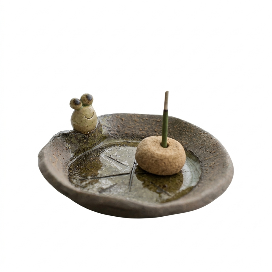 Handmade ceramic incense holder featuring a cute frog figurine, rustic leaf-shaped dish, and central incense insert, designed for stick incense and home decor on a clean white background.