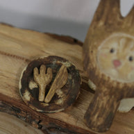 Close-up of the matching ash tray with fork and knife details from The Hungry Foodie Cat handmade ceramic incense holder set on a rustic wood surface
