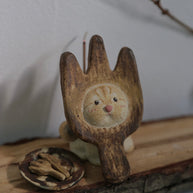 Handmade ceramic incense holder shaped like The Hungry Foodie Cat displayed on a wooden surface with a matching ash tray and incense stick in a lifestyle setting