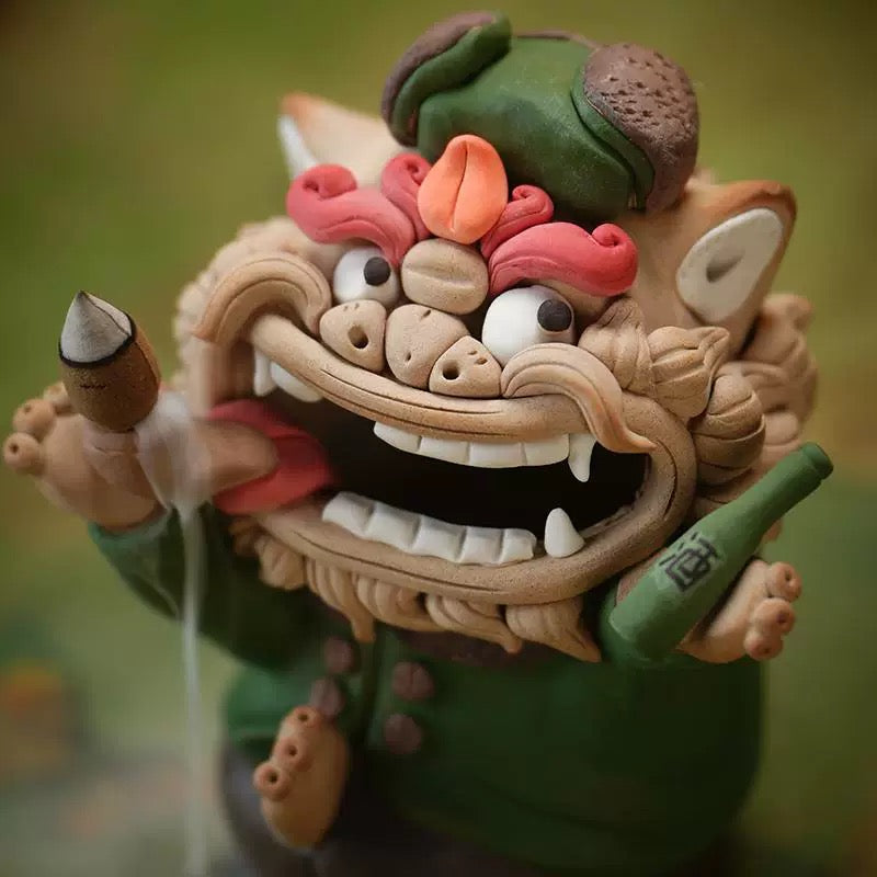 Handmade quirky ceramic incense holder shaped like a green lion figure with visible backflow smoke, holding a bottle and cone burner against a soft green background
