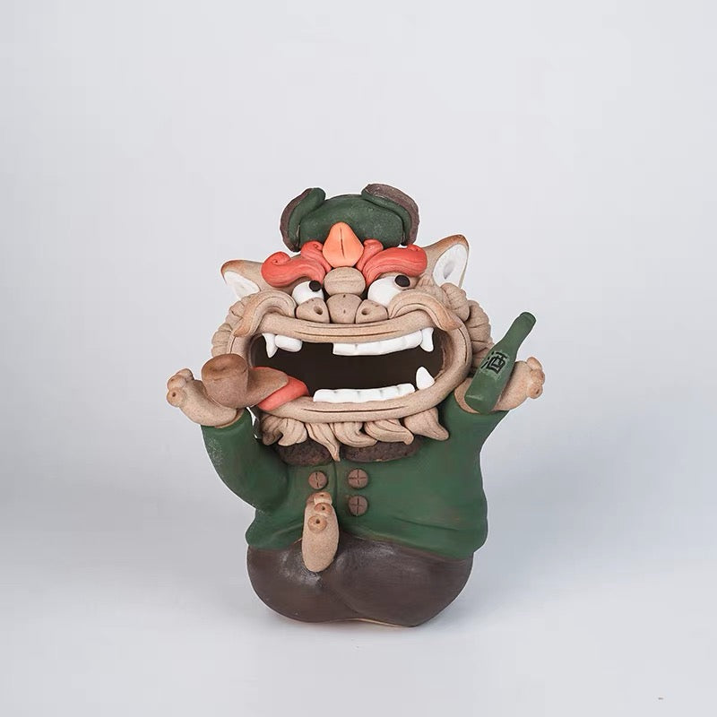 Handmade quirky ceramic incense holder shaped like a green lion figure holding a pipe and bottle on a white background