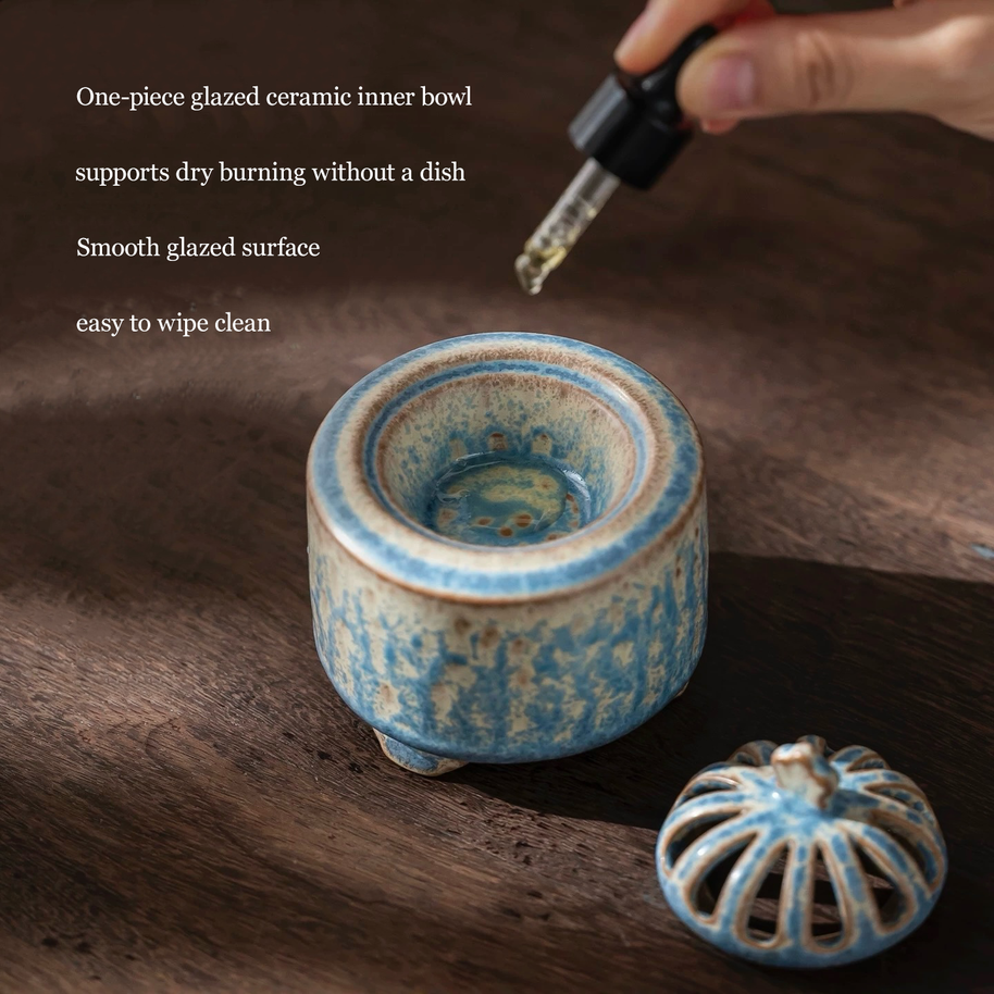 Electric incense burner with timer and handmade ceramic heater in blue glaze, shown with the lid removed to display the one-piece glazed inner bowl for essential oils, resin, and dry incense use on a wooden surface