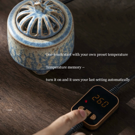 Electric incense burner with timer and handmade ceramic heater in blue glaze, shown with digital temperature controller displaying preset heat memory for easy one-touch operation on a wooden tabletop