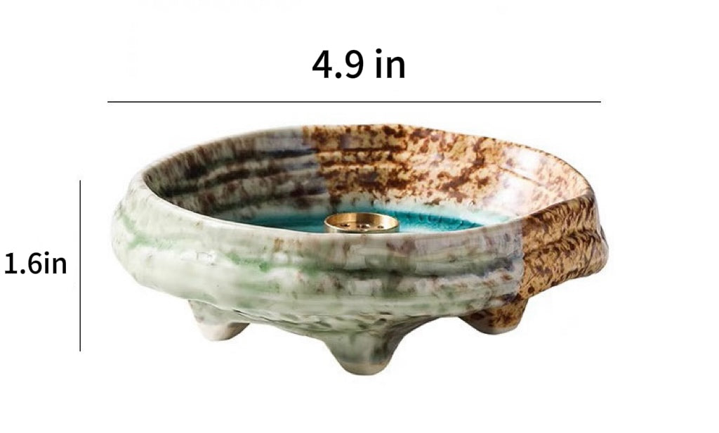 Japanese wabi-sabi style green ceramic incense holder with crackle glaze and three feet, showing size dimensions 4.9 in wide and 1.6 in high on a white background.