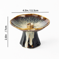 Japanese wabi-sabi style pedestal ceramic incense holder with reactive brown glaze and brass insert, showing size dimensions 4.5 in wide and 2.8 in high on a white background.