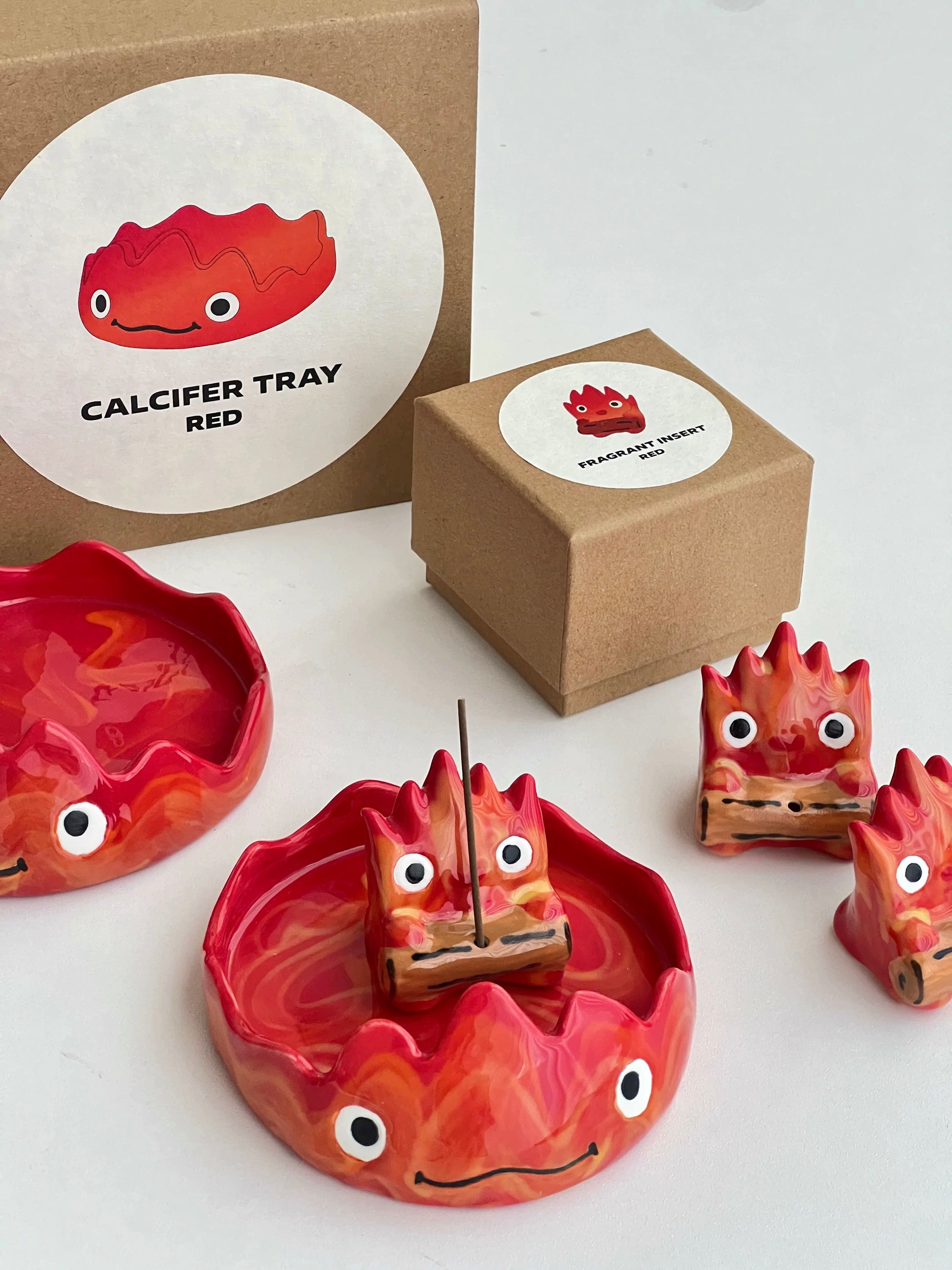 Red flame incense holder with matching tray .
