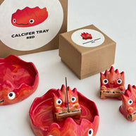 Red flame incense holder with matching tray .