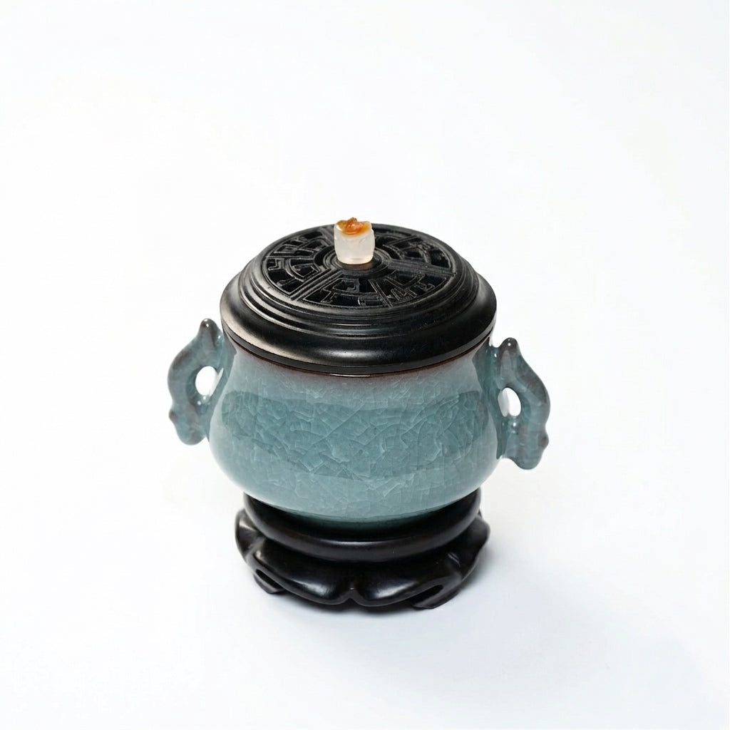 Luxury electric incense burner made of Ge kiln ice-crackle ceramic with side handles, black lid, and matching base