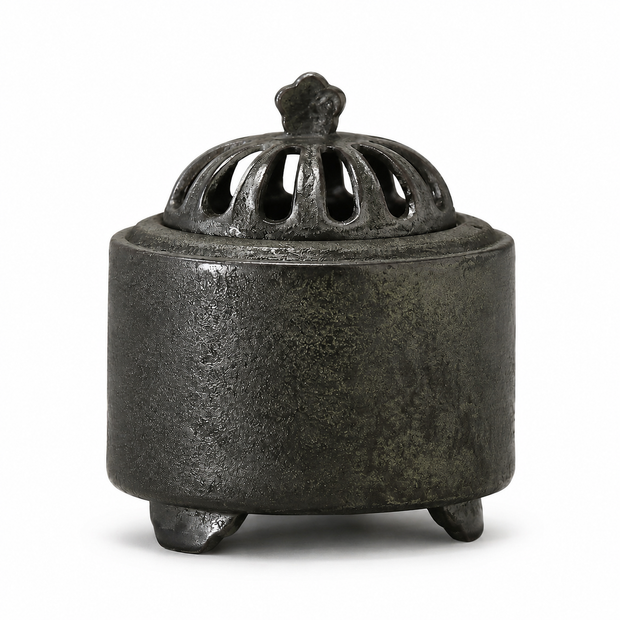 Obsidian black ceramic electric incense burner with a textured finish and vented dome lid displayed on a white background
