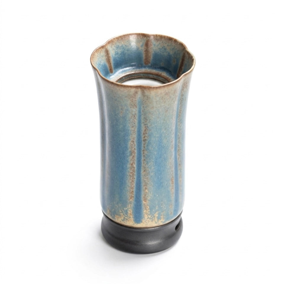 Portable electric incense burner for car and travel with a blue ceramic body and black base on a white background