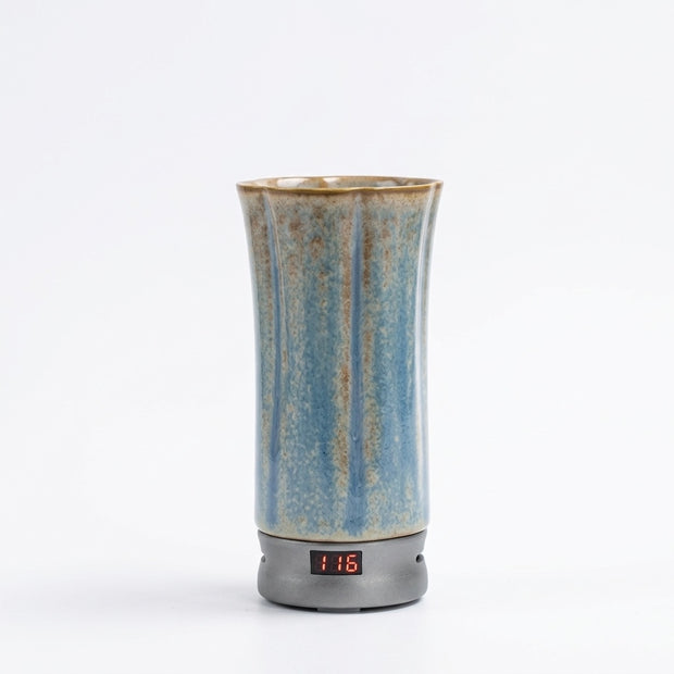 Portable electric incense burner for car and travel with a digital temperature display on a white background