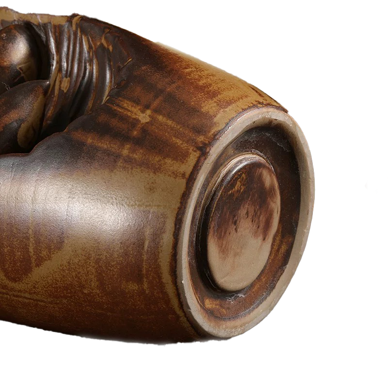 Close-up of the bottom base detail on a premium high-fired ceramic backflow incense holder with a rustic brown glaze