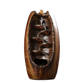 Premium high-fired ceramic backflow incense holder in a rustic brown glaze with cascading smoke waterfall design and incense cone on top against a white background