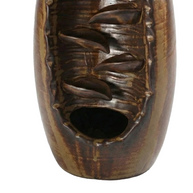 Close-up of the lower cascading channels and collection basin on a premium high-fired ceramic backflow incense holder in a rustic brown glaze