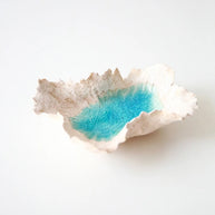 Sea Blossom handmade ceramic incense and candle holder with an organic coral-inspired shape and blue lagoon glaze center, shown empty on a clean white background