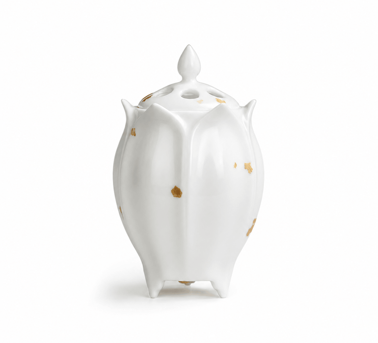 White lotus shaped electric ceramic incense burner with scattered gold flecks and a vented lid displayed on a white background