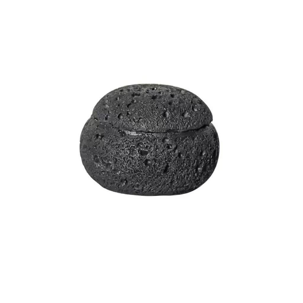 Top view of black cement incense burner lid featuring porous stone texture and airflow perforations, designed for heat diffusion and smoke circulation