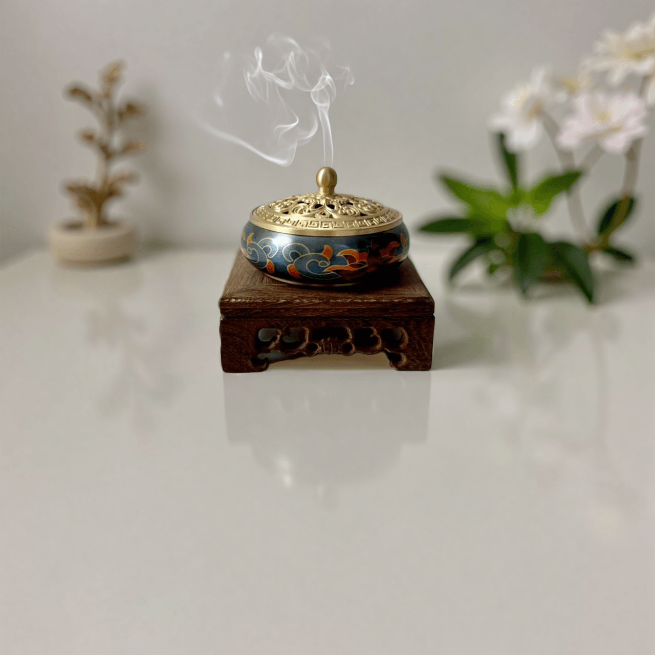 Brass incense burner with colorful inlay, smoke rising from lotus lid