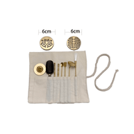 Top view of 8-piece brass incense stamp tool kit fully displayed on white background, including two 6 cm pattern molds and various incense tools in cloth wrap