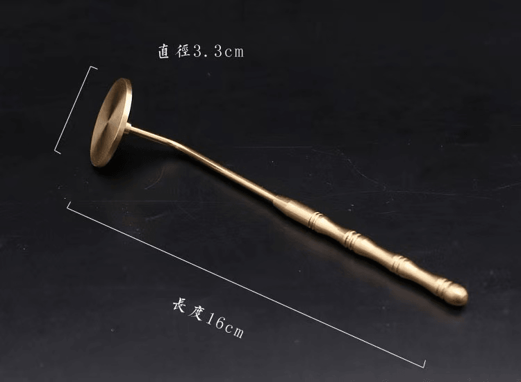 Detailed image of brass incense ash press tool showing 16 cm total length and 3.3 cm diameter of flat head, photographed on dark background