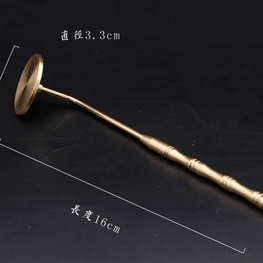 Detailed image of brass incense ash press tool showing 16 cm total length and 3.3 cm diameter of flat head, photographed on dark background